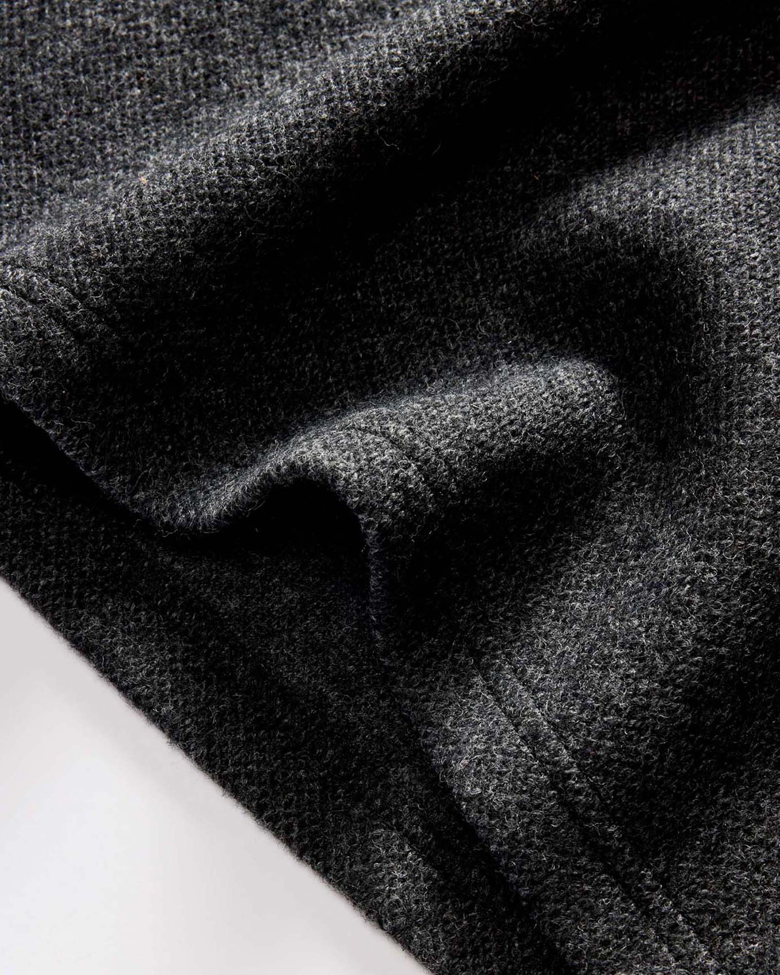 material shot of the hem on The Evans Crew in Charcoal Birdseye Wool, Knits by Taylor Stitch