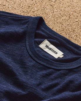 editorial image of The Organic Cotton Tee in Rinsed Indigo in a bin, Knits by Taylor Stitch