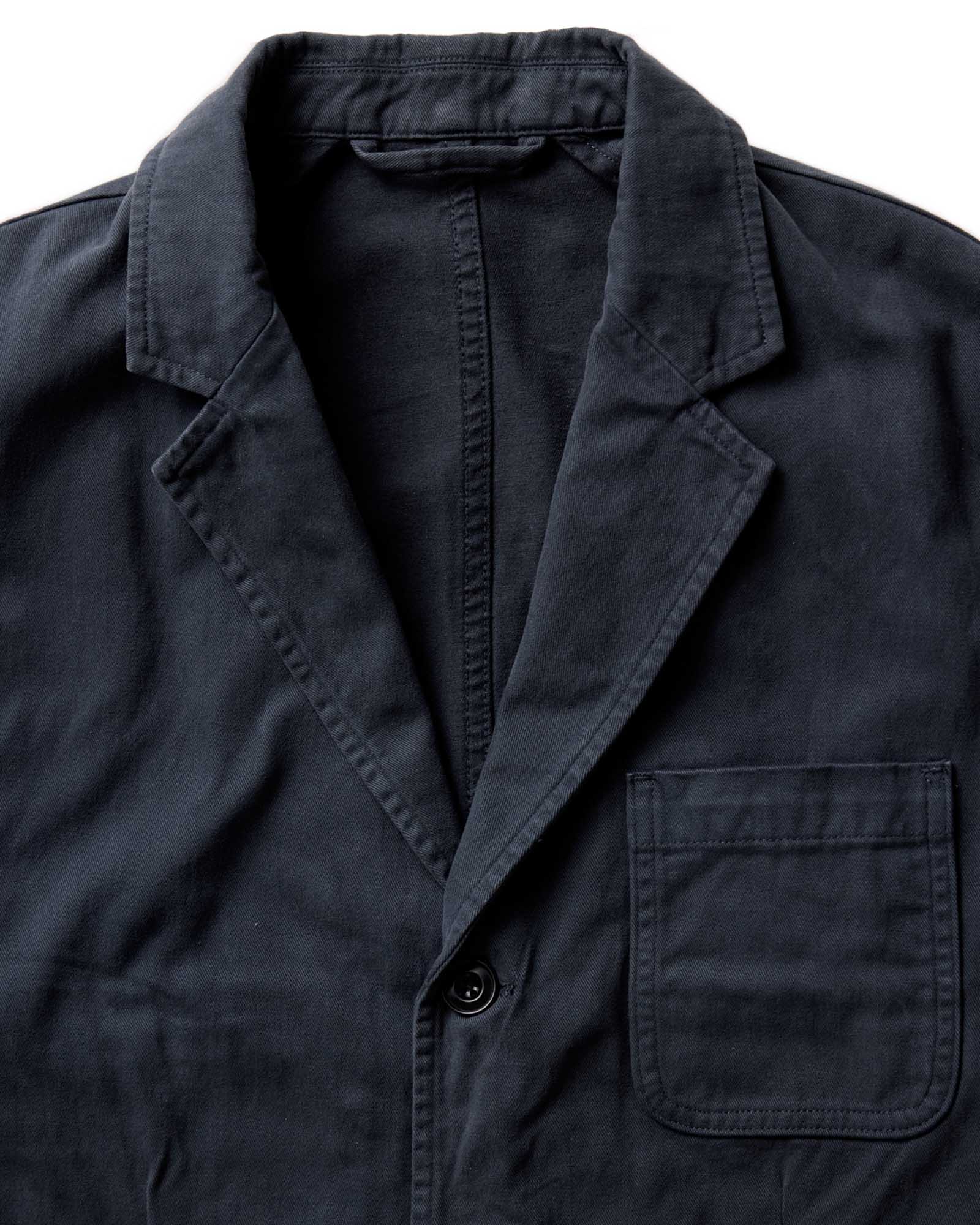 fit model adjusting the cuffs on The Foundation Sportcoat in Organic Navy Twill, Outerwear by Taylor Stitch