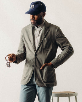 fit model posing in The Foundation Sportcoat in Organic Smoked Olive Twill, Outerwear by Taylor Stitch