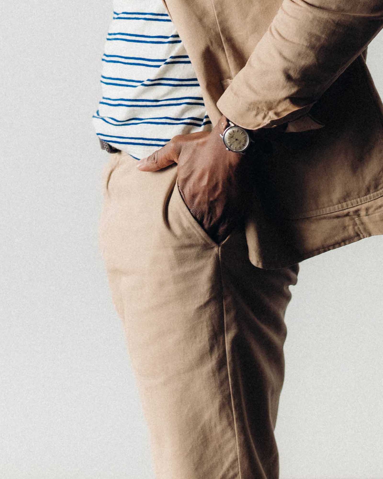 fit model with his hand in his pocket wearing The Democratic Foundation Pant in Organic Khaki, Bottoms by Taylor Stitch
