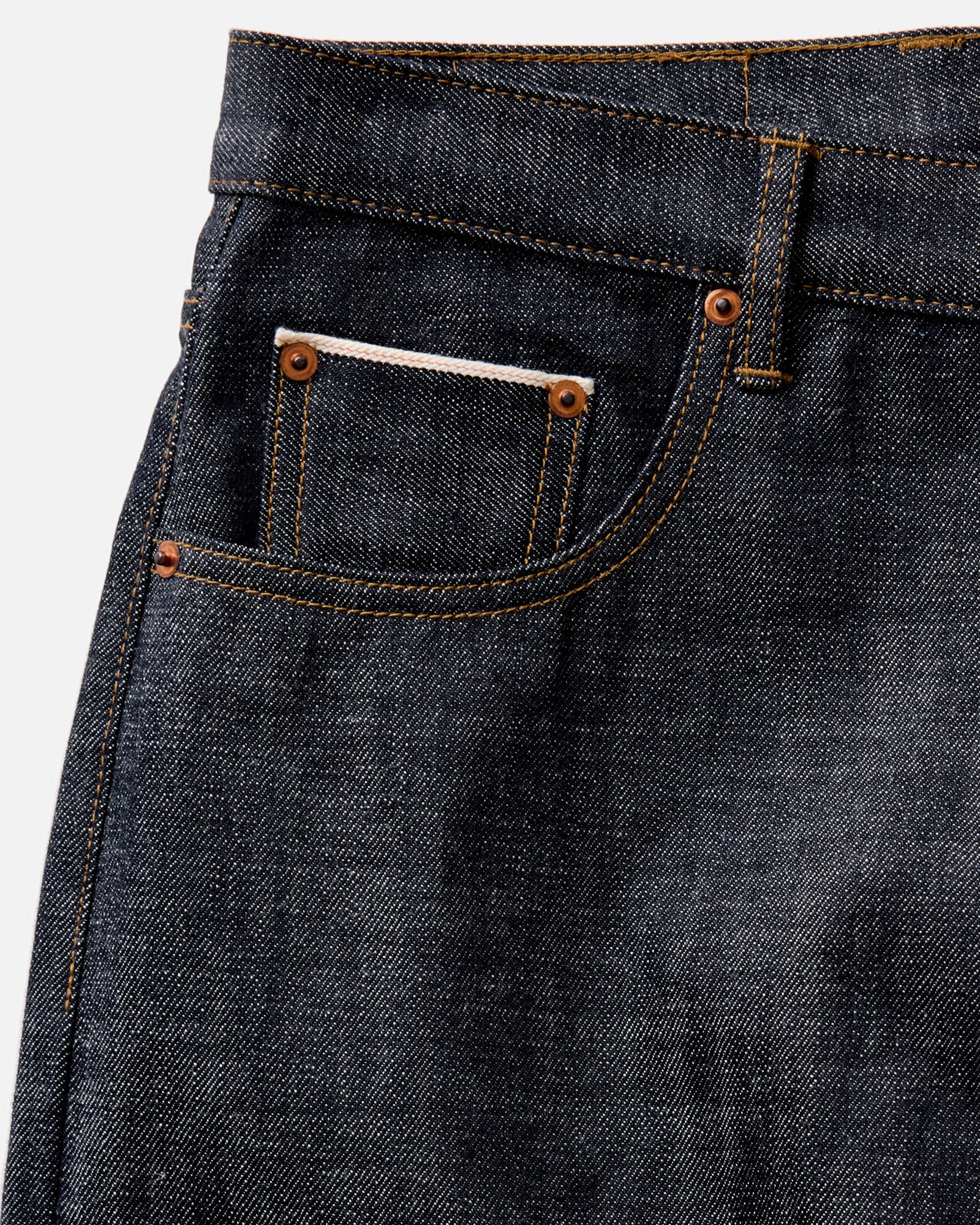 folded flatlay of the back of The Democratic Jean in Rigid Organic Selvedge, Bottoms by Taylor Stitch