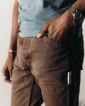 fit model posing in The Chore Pant in Aged Penny Chipped Canvas, Bottoms by Taylor Stitch