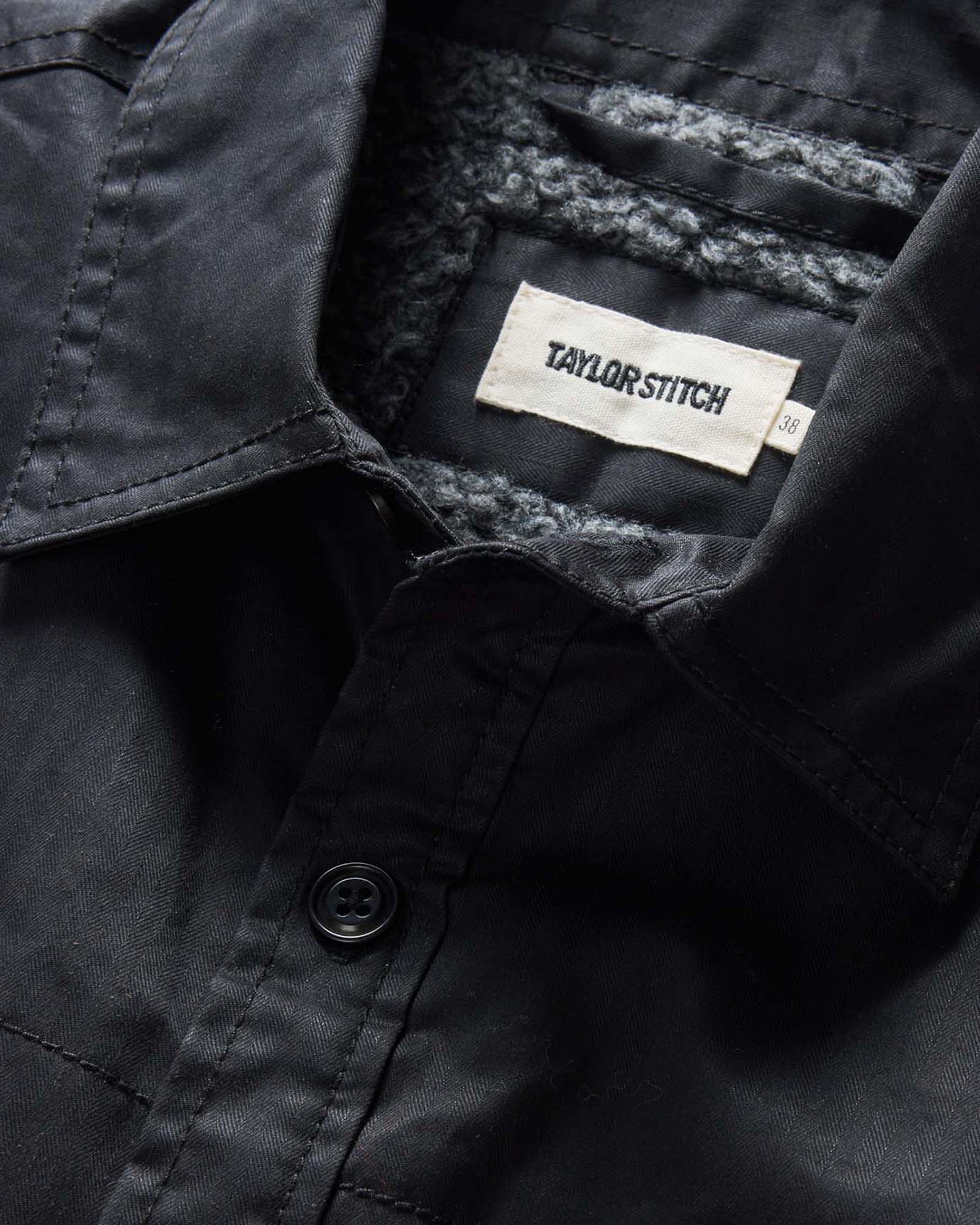 material shot of the collar on The Fender Jacket in Coal Dry Wax, Outerwear by Taylor Stitch