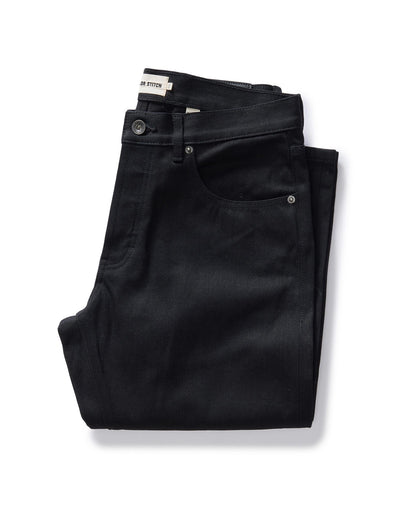 folded flatlay of The Democratic Jean in Rigid Black Organic Selvedge