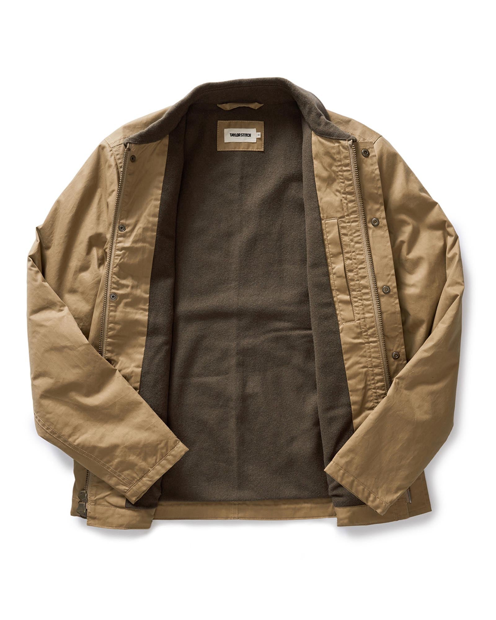 editorial flatlay of the inside of The Deck Jacket in Khaki Dry Wax, Outerwear by Taylor Stitch