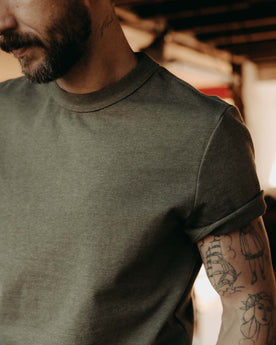 fit model showing off the sleeves on The Organic Cotton Shop Tee in Army Twist, Knits by Taylor Stitch