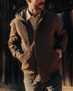 fit model with his hands in his pockets wearing The Workhorse Hoodie in Aged Penny Chipped Canvas, Outerwear by Taylor Stitch