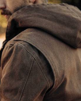 fit model showing off the hood on The Workhorse Hoodie in Aged Penny Chipped Canvas, Outerwear by Taylor Stitch