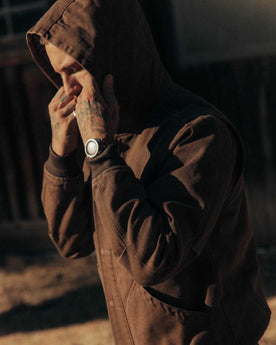 fit model adjusting the hood on The Workhorse Hoodie in Aged Penny Chipped Canvas, Outerwear by Taylor Stitch