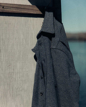 editorial image of The Utility Shirt in Indigo Ash Wool Canvas hanging, Wovens by Taylor Stitch