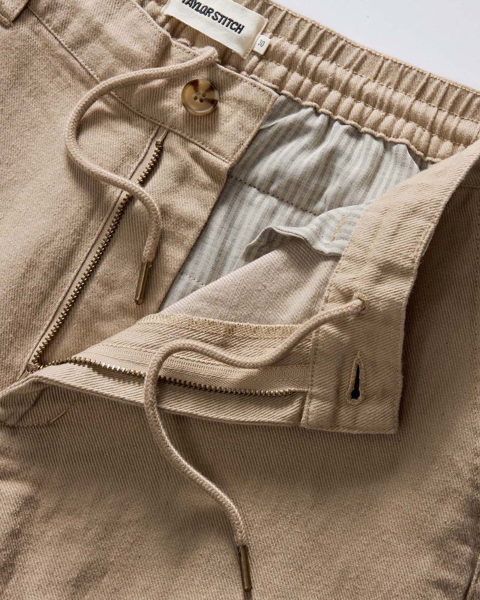 material shot of the zipper on The Carmel Pant in Heather Khaki Cotton Linen, Bottoms by Taylor Stitch