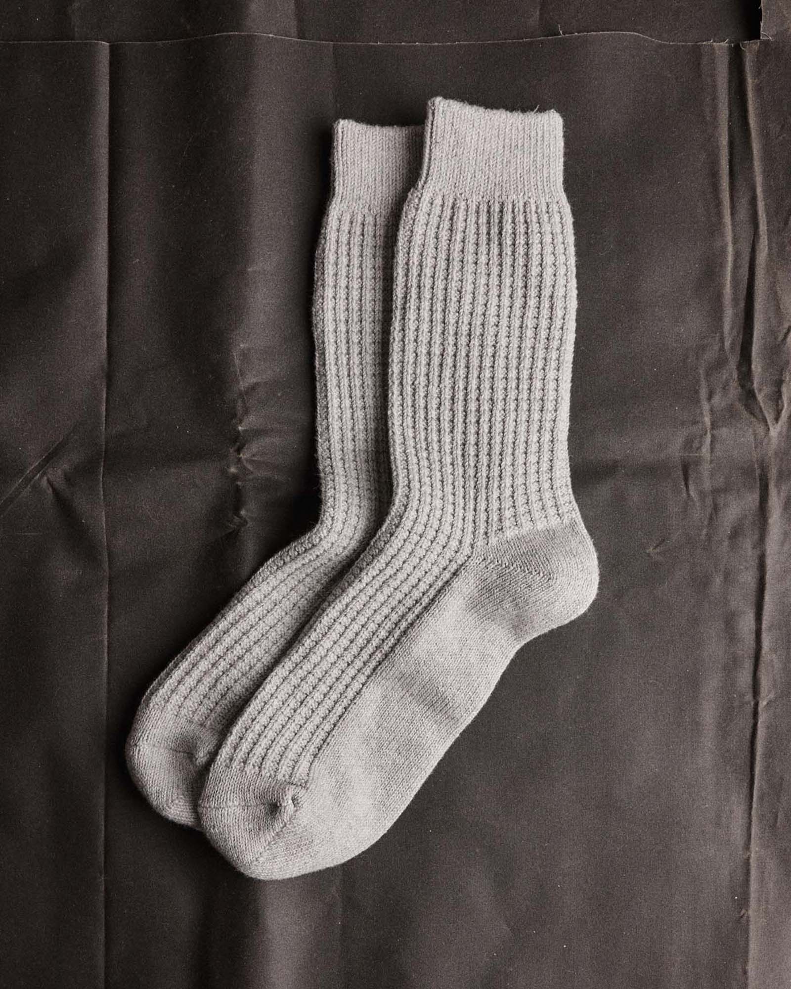 editorial flatlay of The Waffle Sock in Heather Grey, Accessories by Taylor Stitch