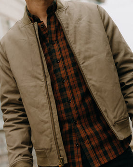 fit model showing the zipper front of The Insulated Bomber Jacket in Fatigue Olive Dry Wax, Outerwear by Taylor Stitch
