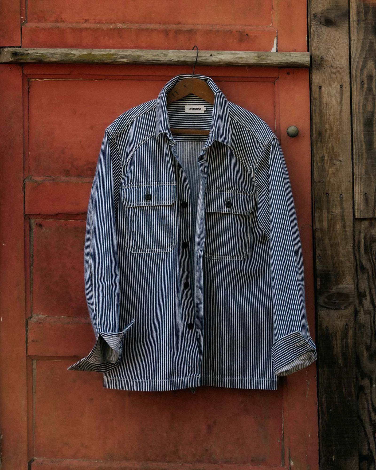 editorial image of The Shop Shirt in Rinsed Indigo Selvedge hanging, Wovens by Taylor Stitch