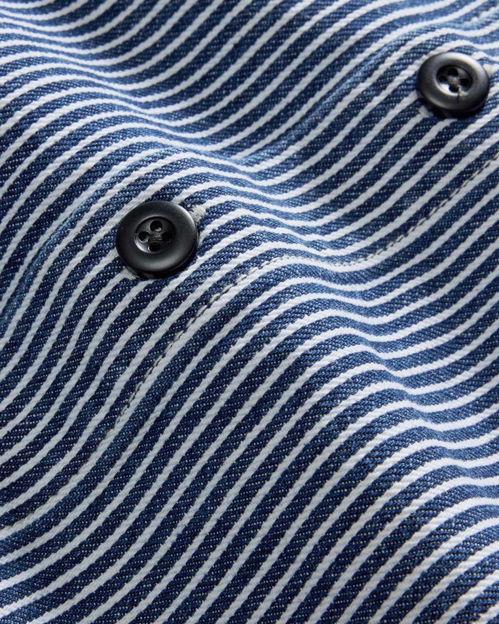 material shot of the buttons on The Shop Shirt in Rinsed Indigo Selvedge, Wovens by Taylor Stitch