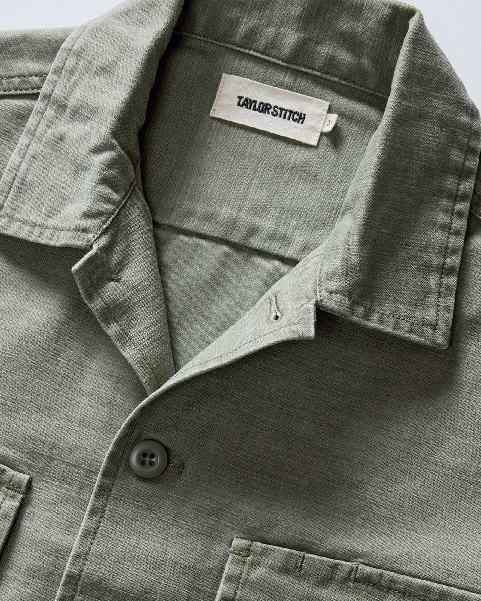 material shot of the collar on The Short Sleeve Surplus Shirt in Field Olive Reverse Sateen, Wovens by Taylor Stitch
