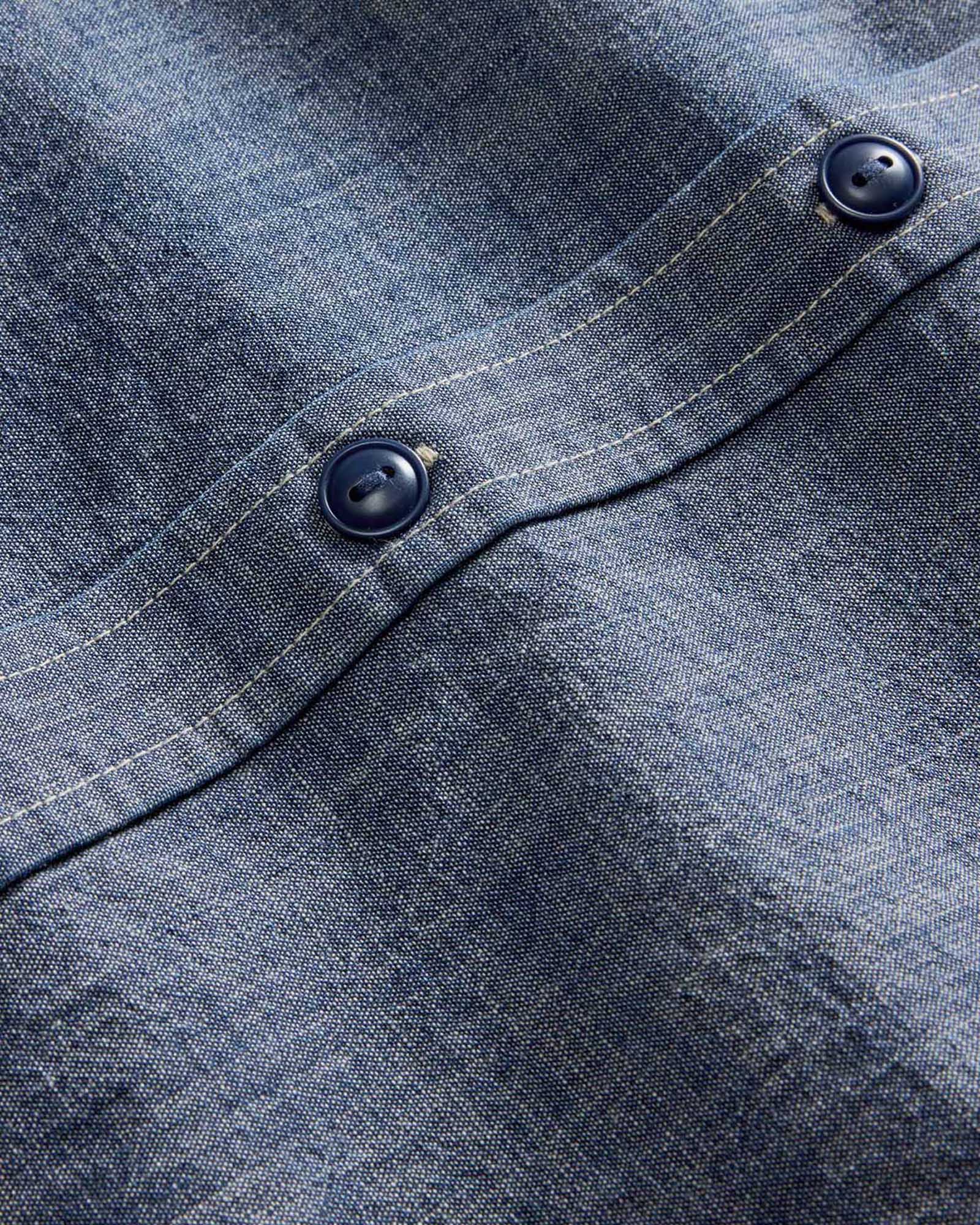 material shot of the buttons on The Short Sleeve Utility Shirt in Indigo Selvedge Chambray, Wovens by Taylor Stitch