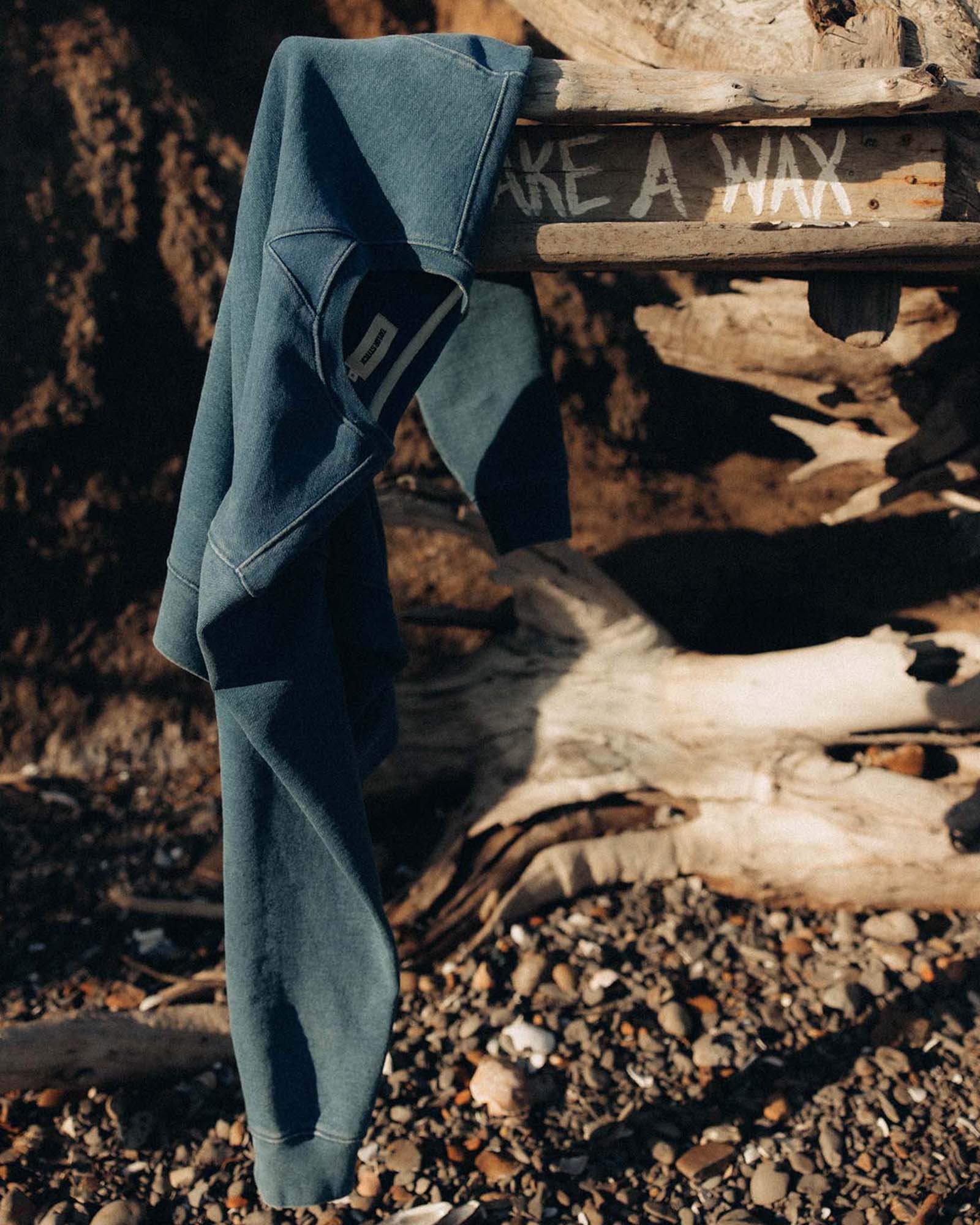 editorial image of The Apres Crew in Washed Indigo Terry hanging, Knits by Taylor Stitch