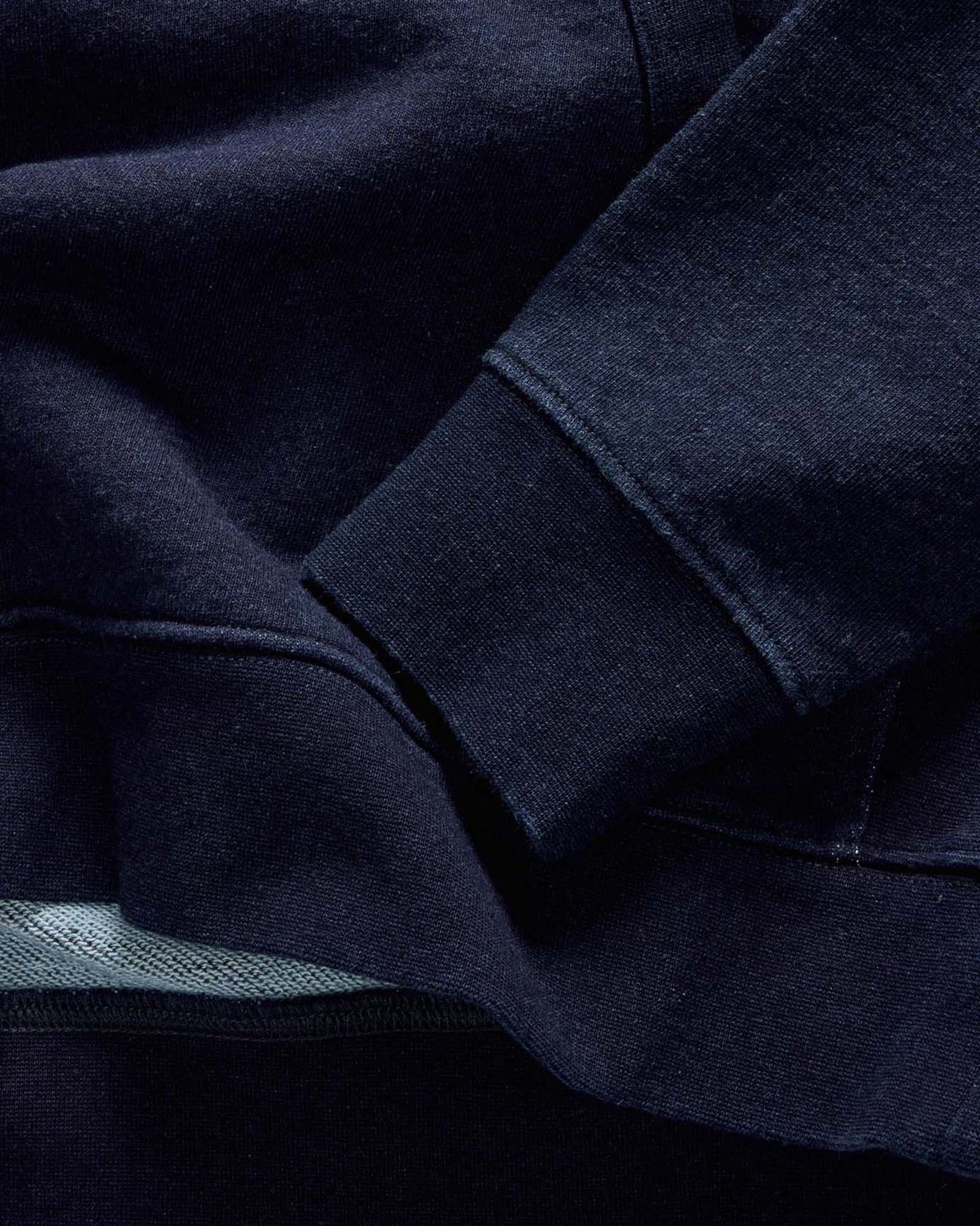 material shot of the hem on The Apres Quarter Zip in Rinsed Indigo Terry, Knits by Taylor Stitch