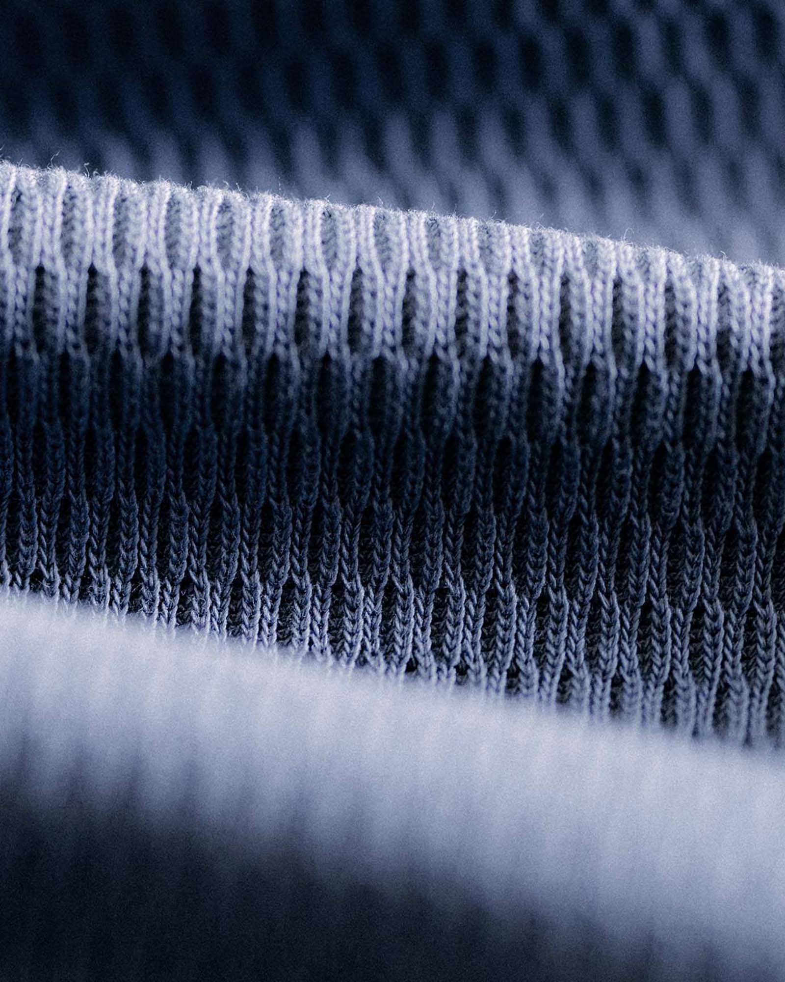 material shot of the waffle on The Organic Cotton Crew in Washed Blue Waffle, Knits by Taylor Stitch