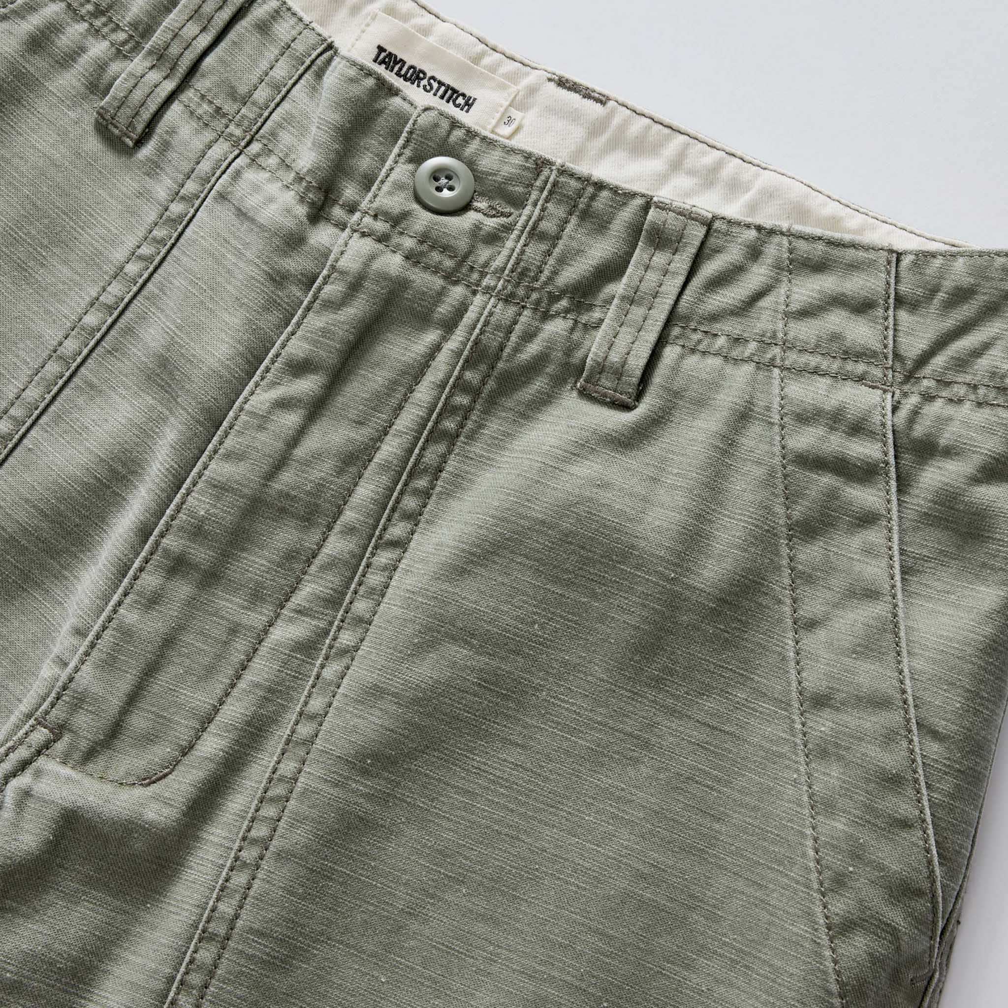 material shot of the waistband on The Surplus Short in Field Olive Reverse Sateen, Bottoms by Taylor Stitch