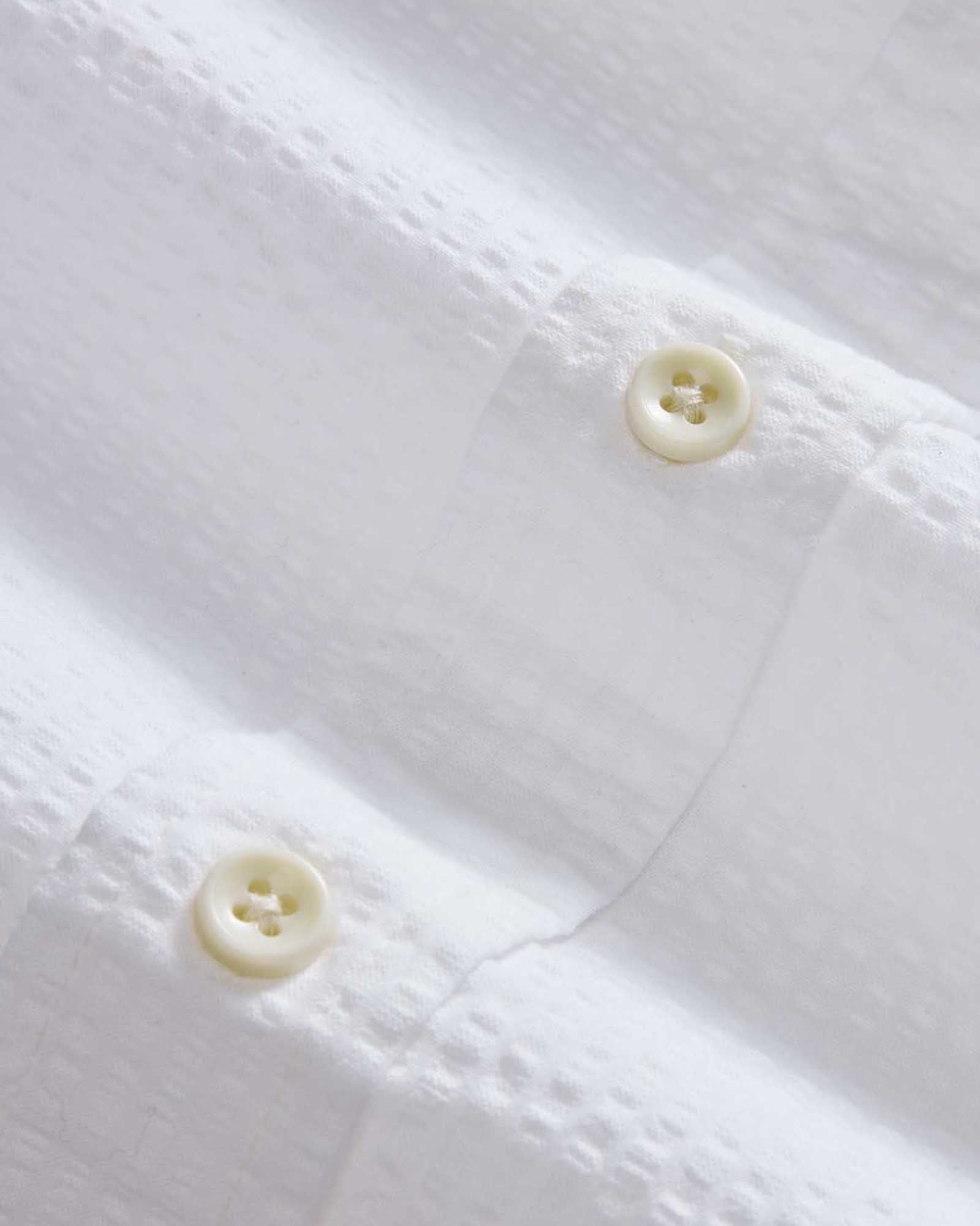 material shot of the buttons on The Jack in White Seersucker, Wovens by Taylor Stitch