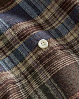 material shot of the buttons on The Short Sleeve Jack in Atlantic Blue Plaid, Wovens by Taylor Stitch