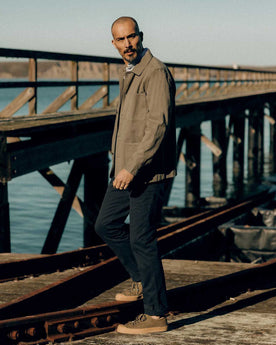 fit model walking wearing The Democratic Foundation Pant in Organic Navy, Bottoms by Taylor Stitch
