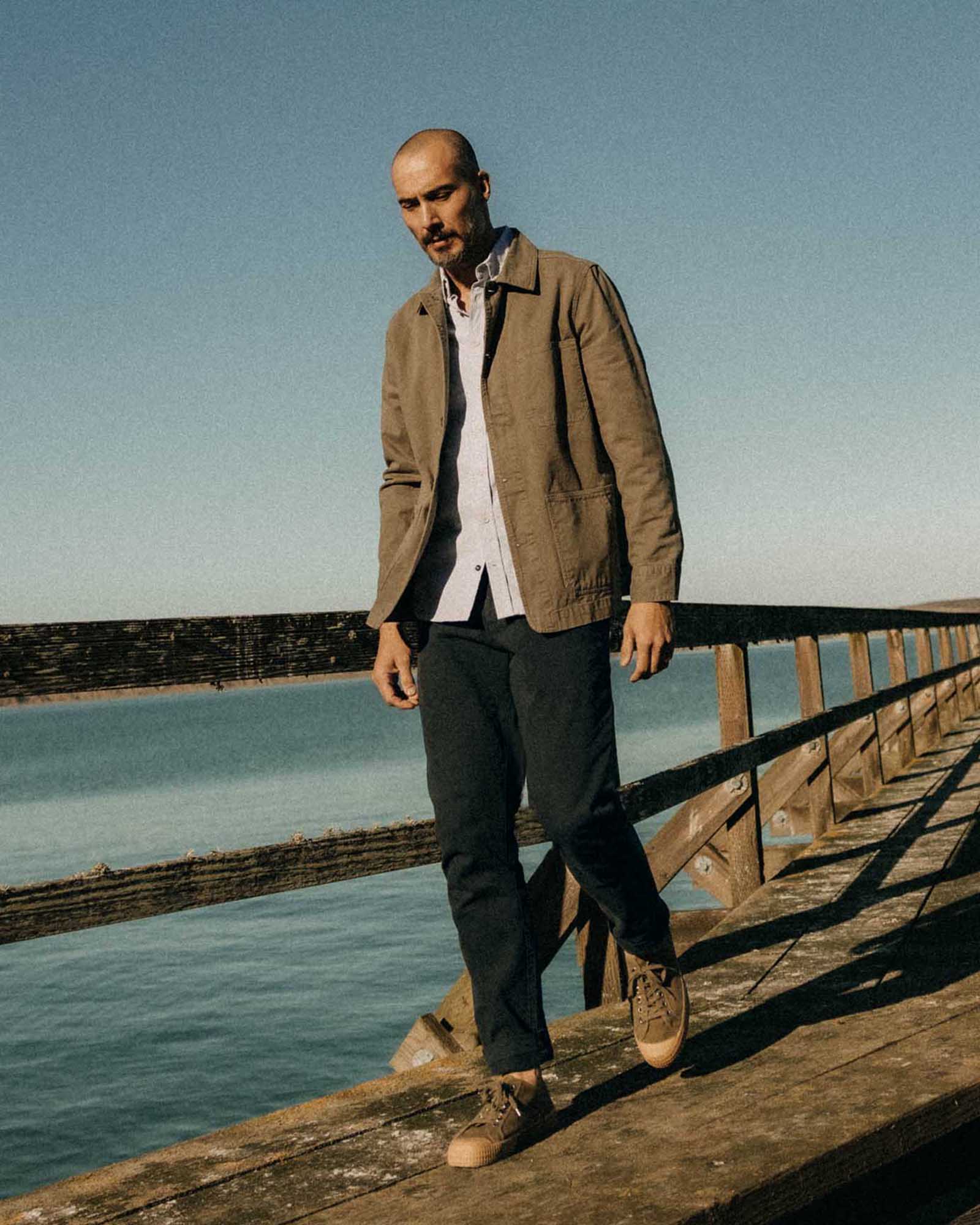 fit model posing in The Democratic Foundation Pant in Organic Navy, Bottoms by Taylor Stitch