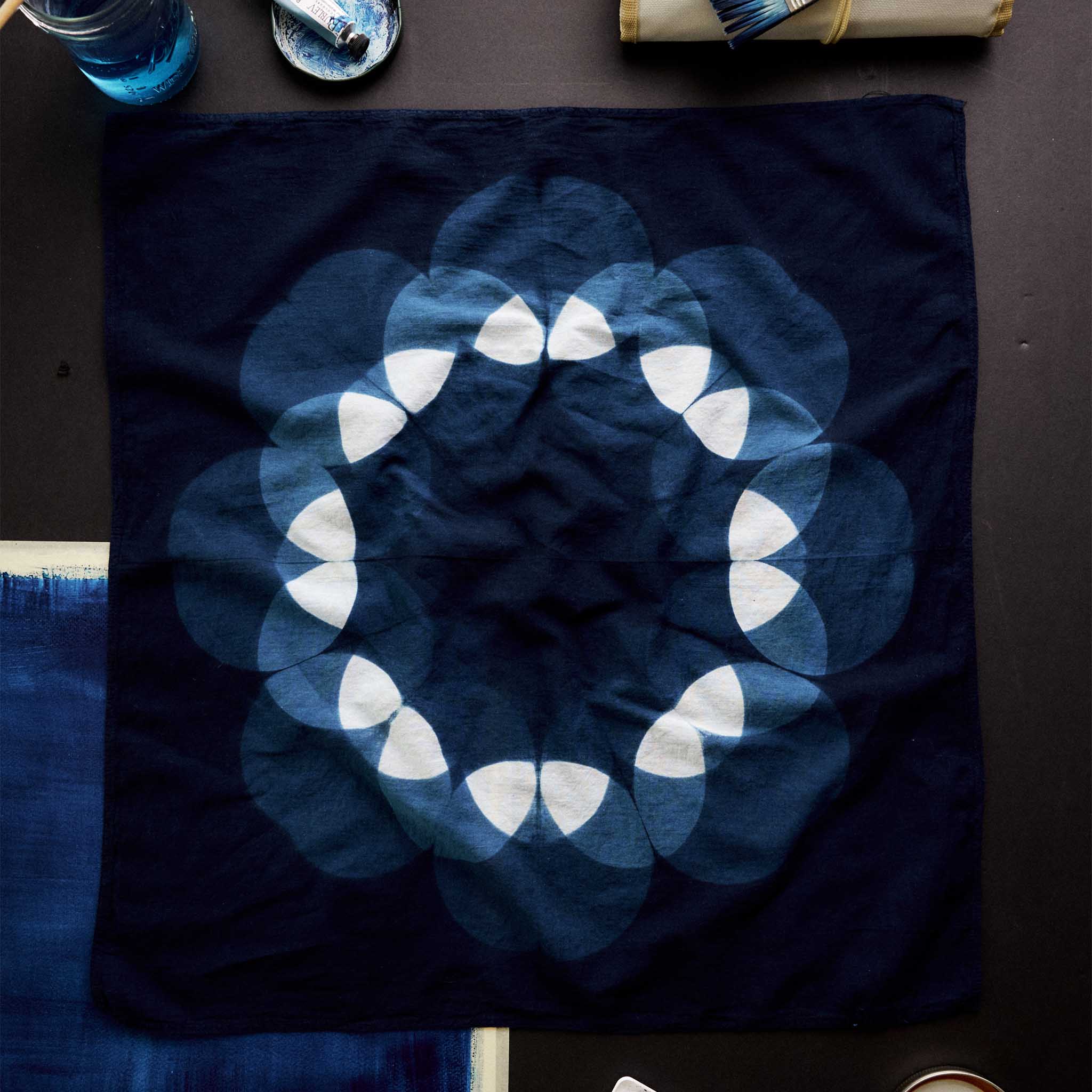 editorial flatlay of The Hand Dyed Bandana in Indigo Petal, Accessories by Taylor Stitch