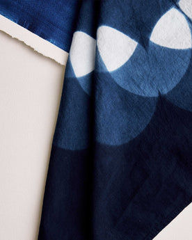 editorial faltlay of The Hand Dyed Bandana in Indigo Petal next to painting, Accessories by Taylor Stitch