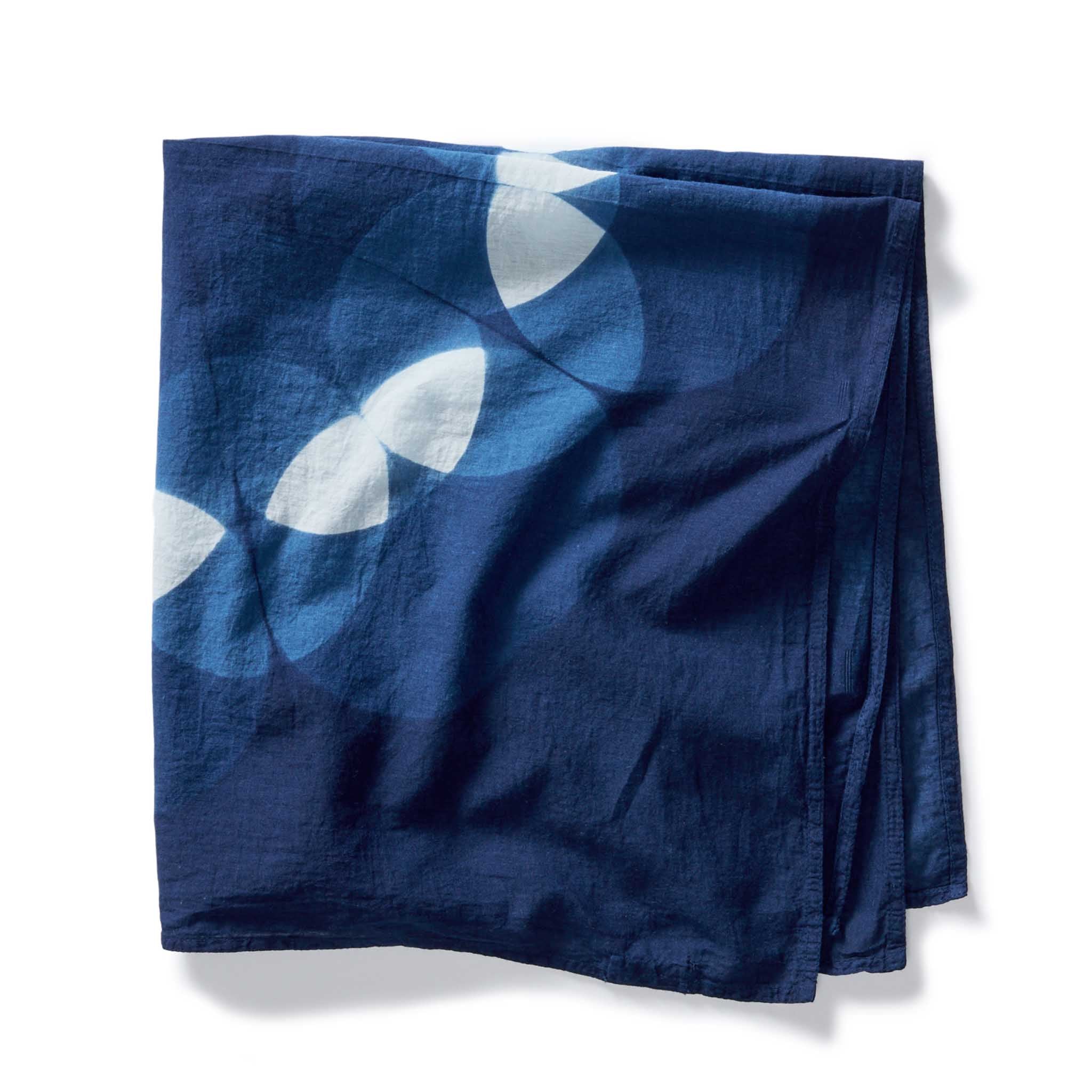 editorial flatlay of folded The Hand Dyed Bandana in Indigo Petal, Accessories by Taylor Stitch