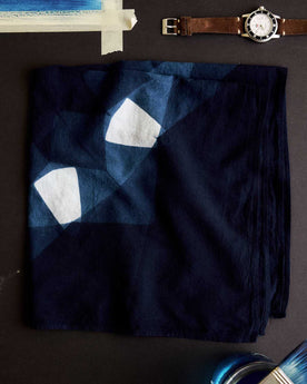 editorial image of The Hand Dyed Bandana in Indigo Burst folded, Accessories by Taylor Stitch