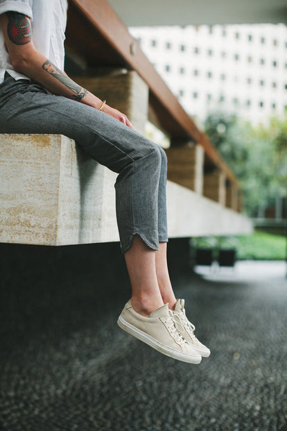 Modelling the pants - legs hanging over the edge of a deck.