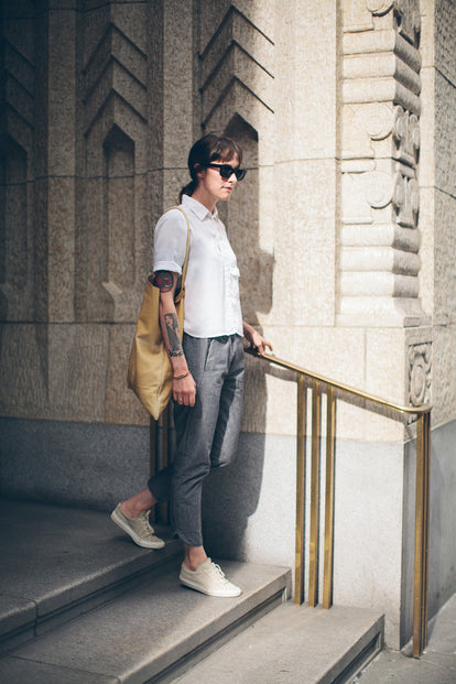 Modelling the pants - walking down steps holding a brass hand rail.