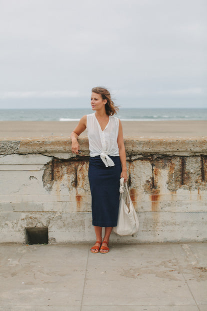 Modeling The Samantha, poised by the sea wall, tote in hand.