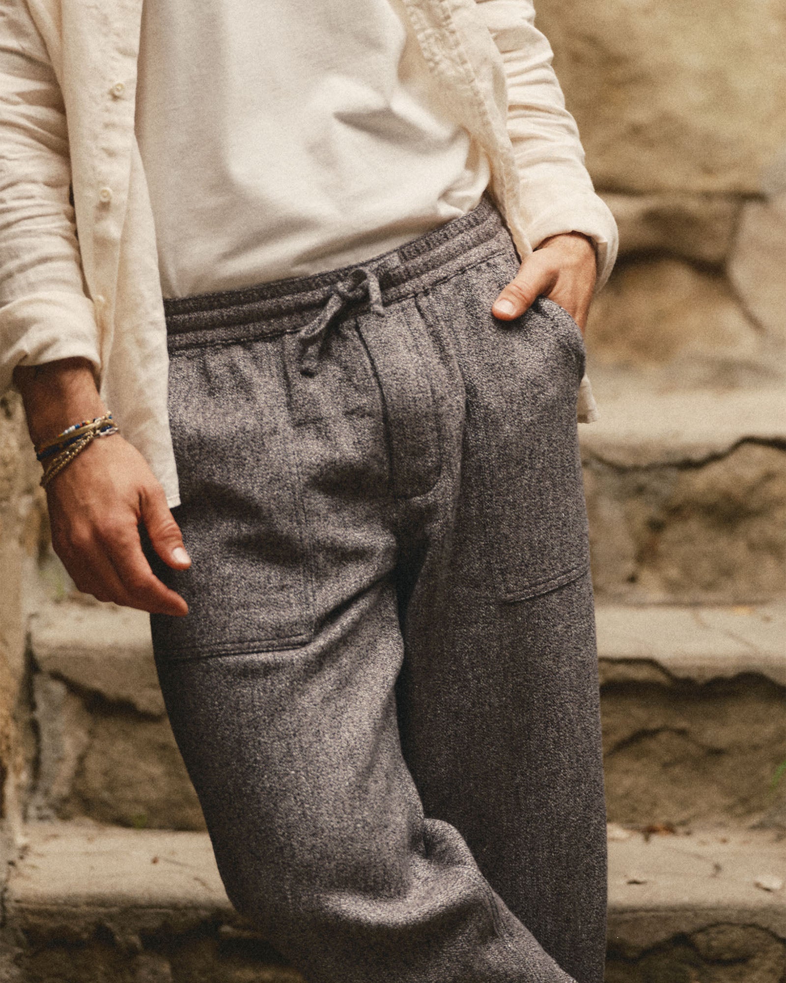 fit model with his hand in his pocket wearing The Breakwater Pant in Grey Marl Hemp, Bottoms by Taylor Stitch