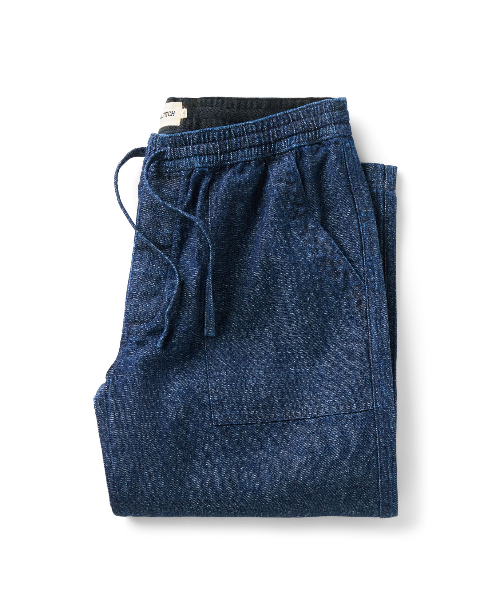 folded flatlay of The Breakwater Pant in Rinsed Indigo Hemp Denim, Bottoms by Taylor Stitch