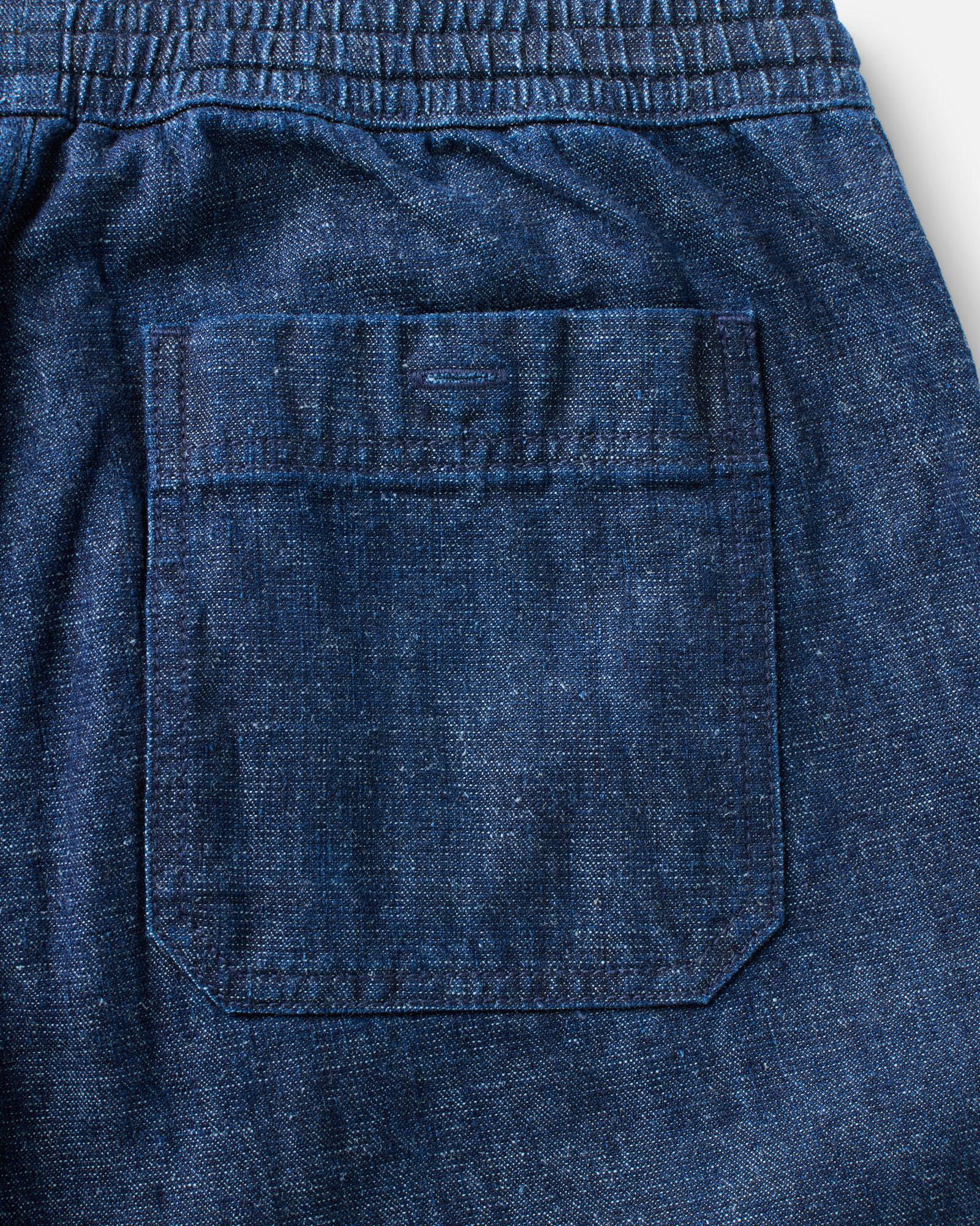 material shot of the back pocket on The Breakwater Pant in Rinsed Indigo Hemp Denim, Bottoms by Taylor Stitch