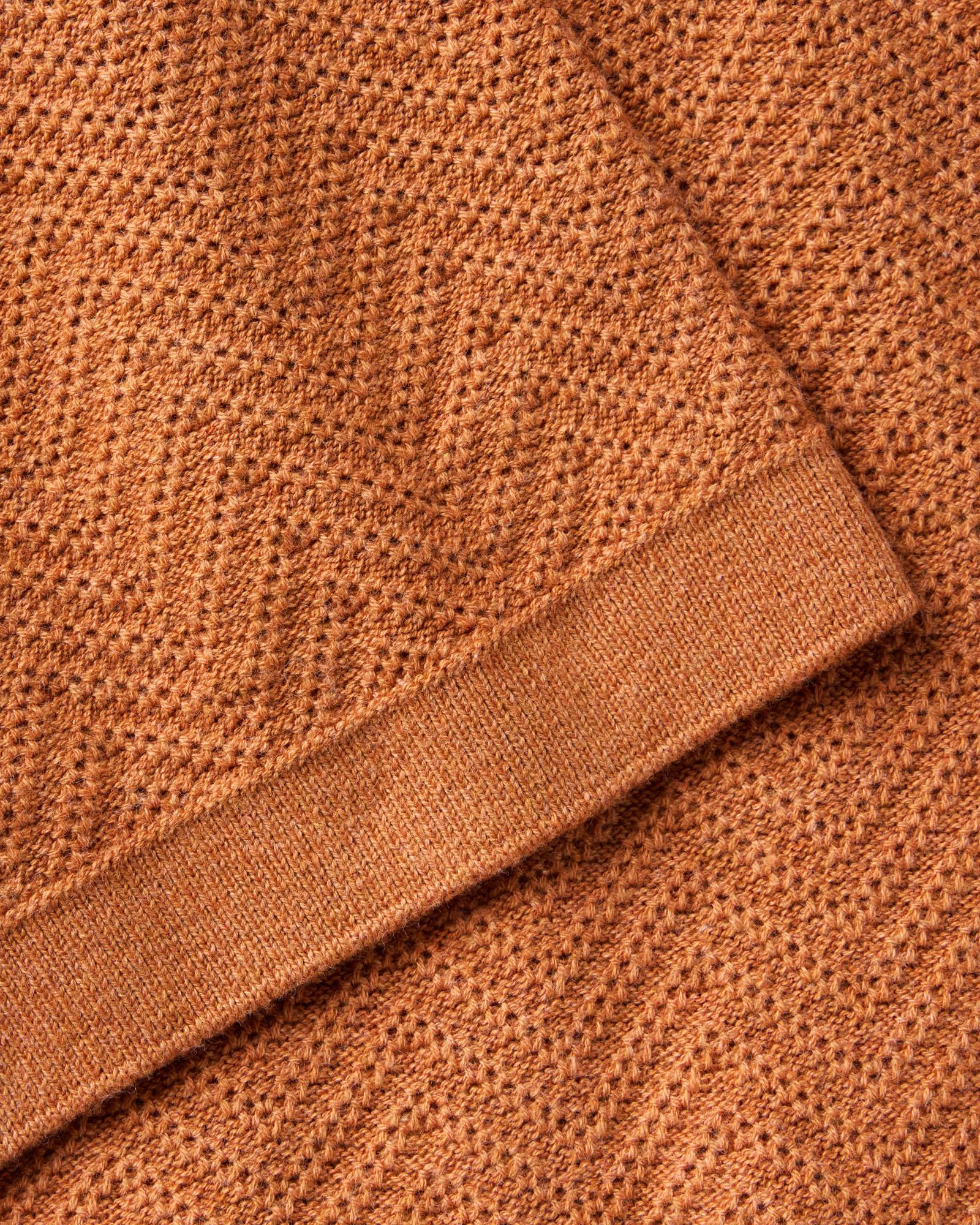 material shot of the sleeve on The Button Down Polo in Desert Herringbone, Knits by Taylor Stitch