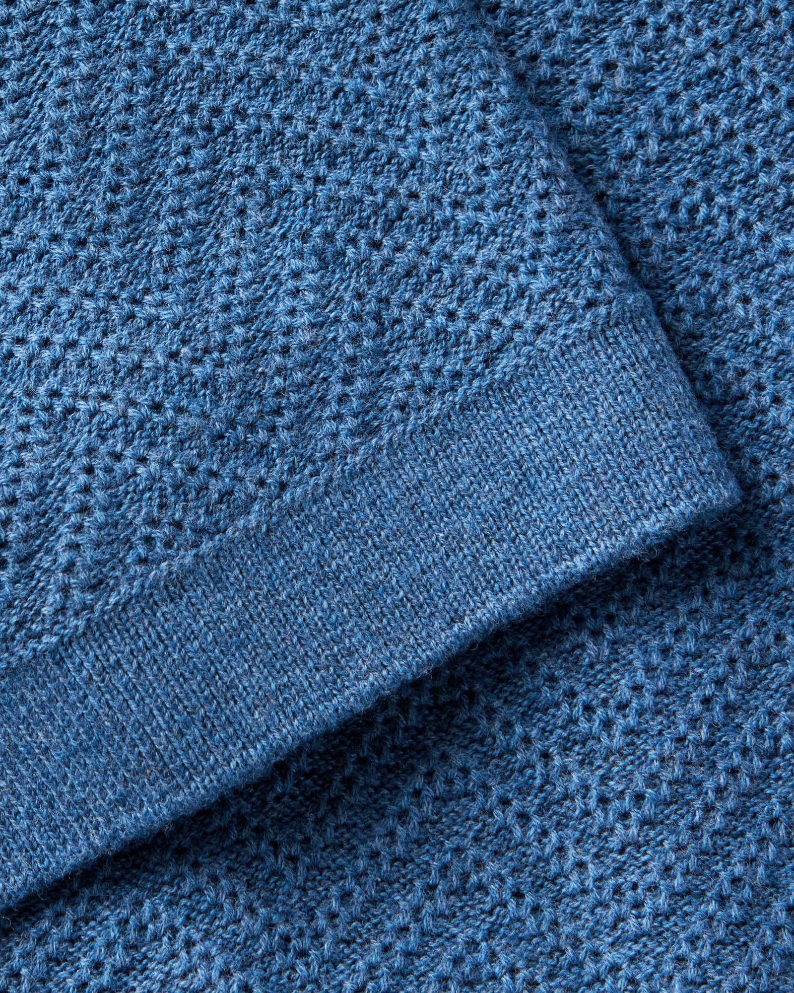 material shot of the sleeve on The Button Down Polo in Gulf Stream Herringbone, Knits by Taylor Stitch