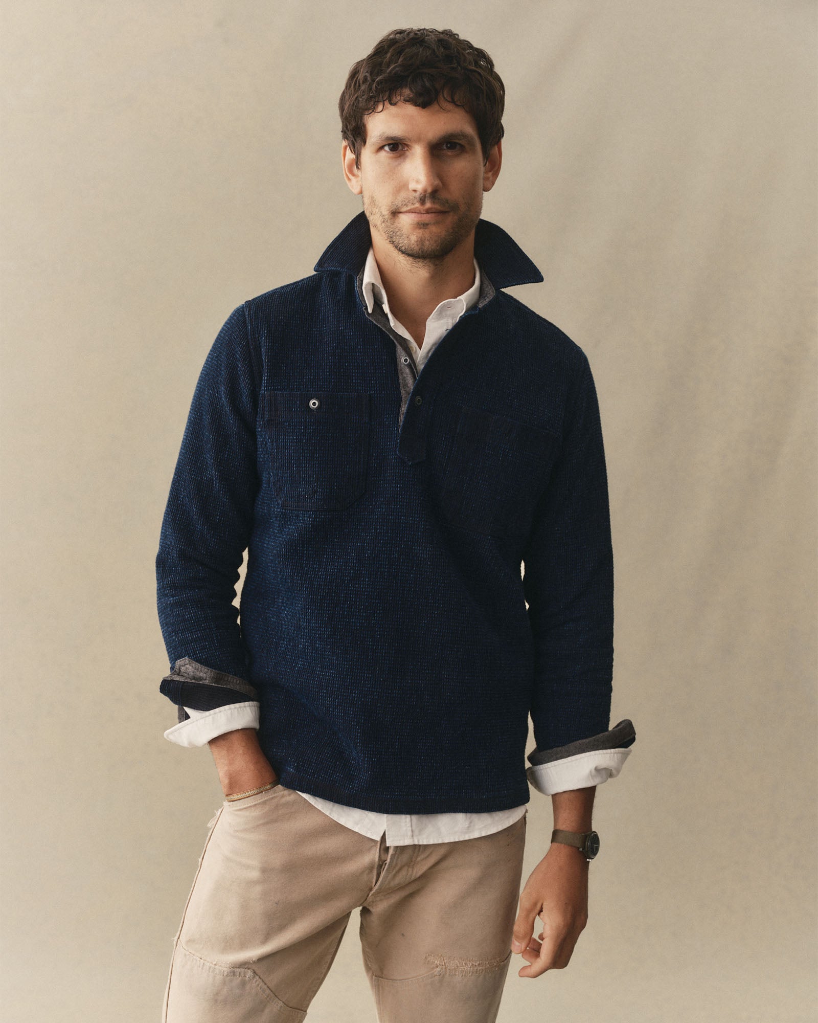 fit model posing in The Canal Popover in Rinsed Indigo, Knits by Taylor Stitch