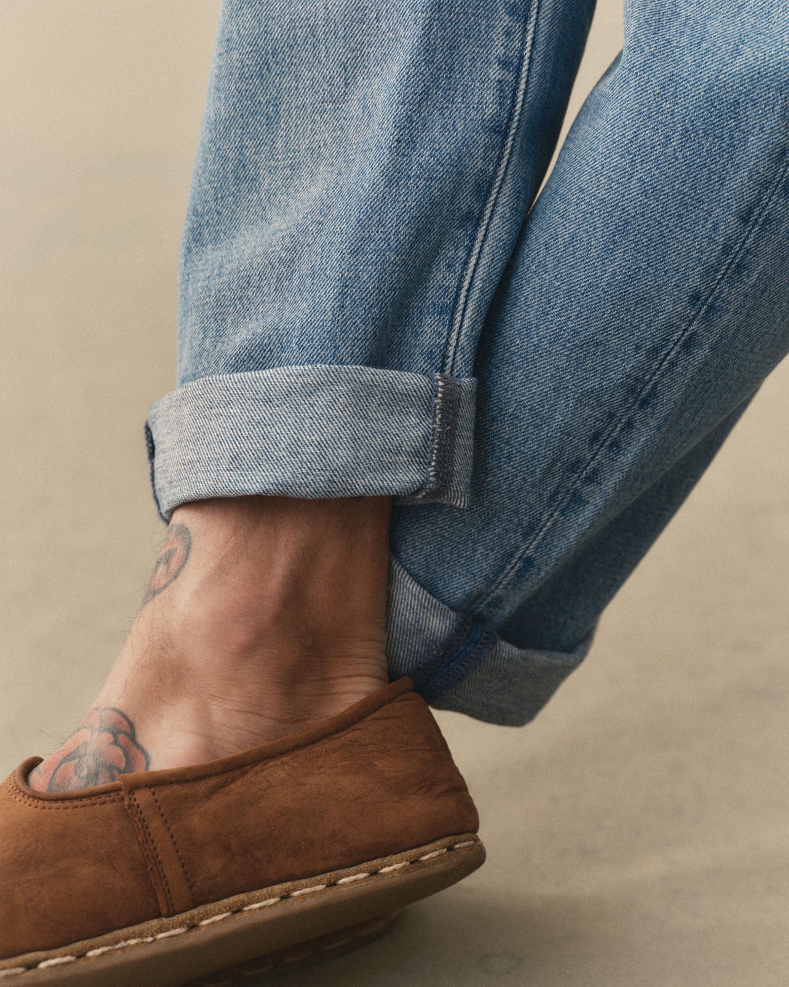 fit model showing off the cuffs on The Democratic Jean in Light Wash Hemp Denim, Bottoms by Taylor Stitch
