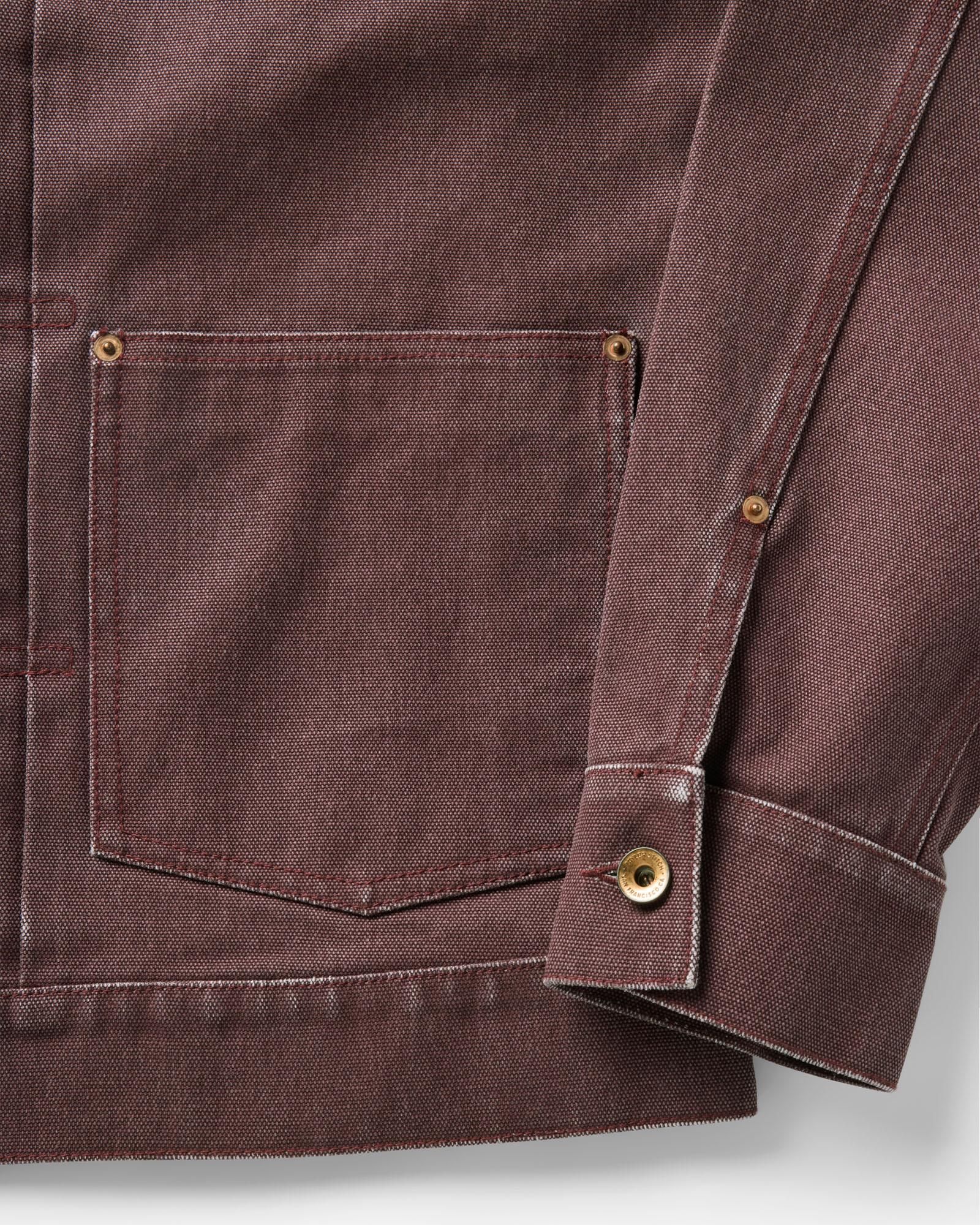 material shot of the sleeve on The Ryder Jacket in Burgundy Chipped Canvas, Outerwear by Taylor Stitch