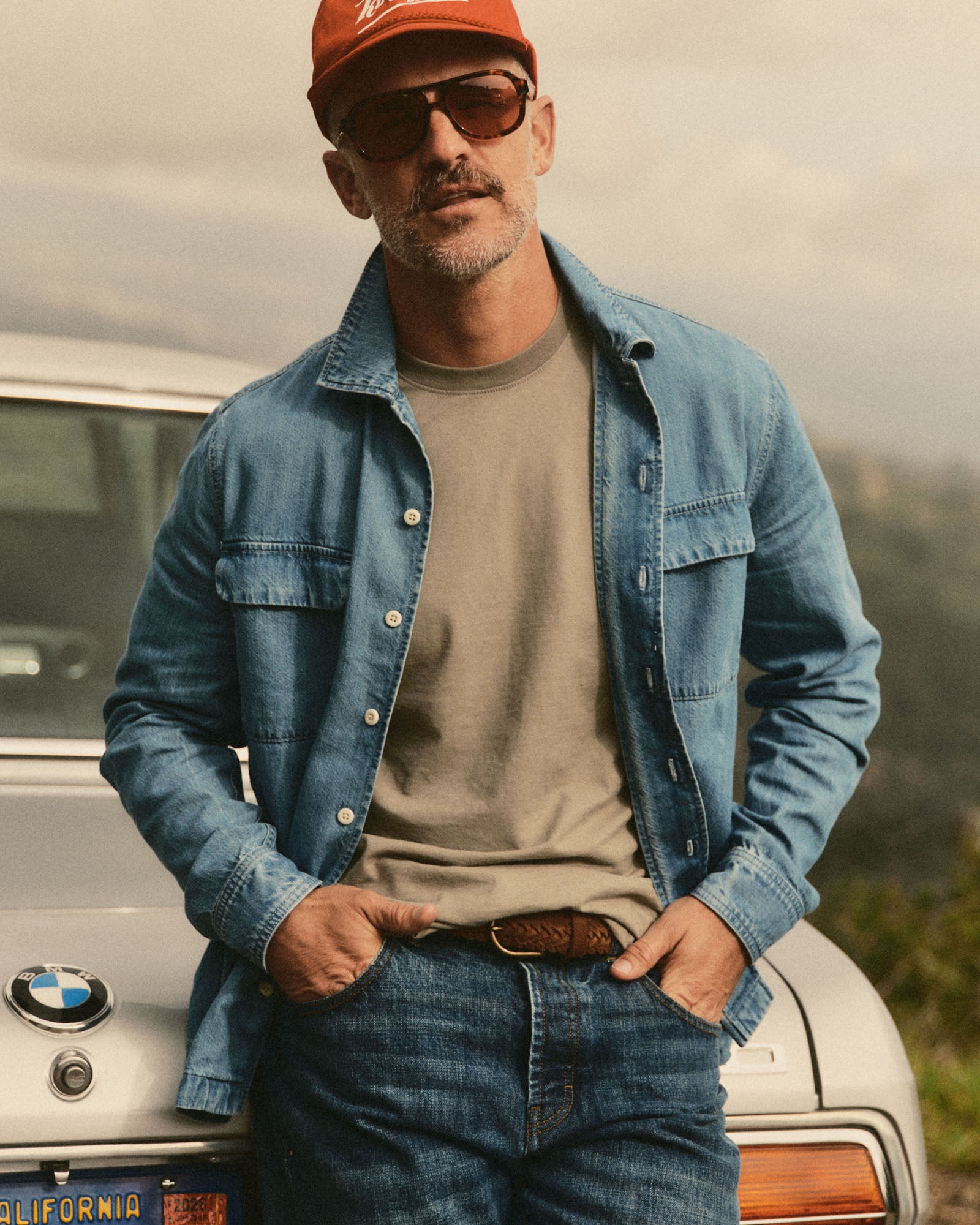 fit model showing off The Shore Shirt in Washed Indigo Twill, Wovens by Taylor Stitch