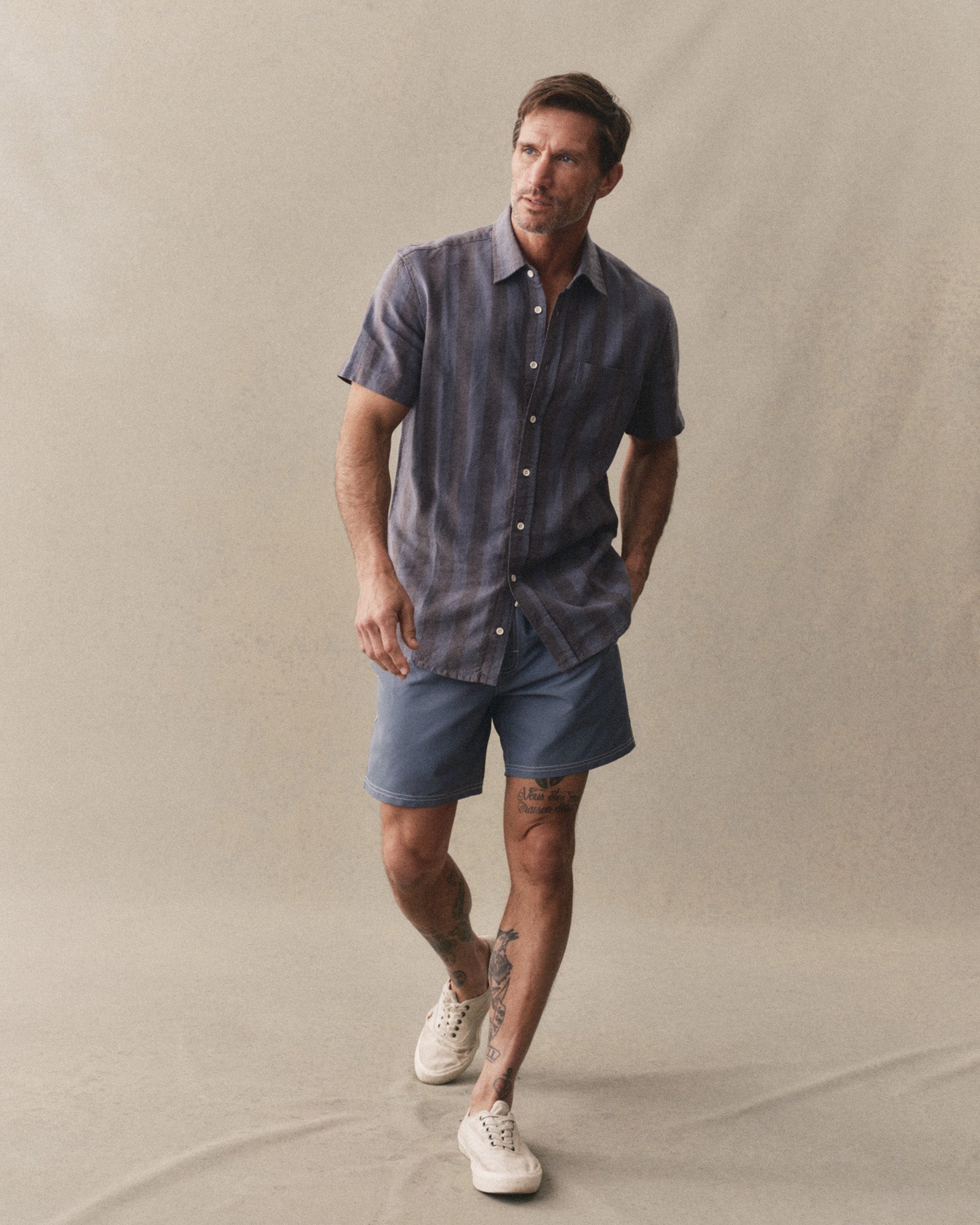 fit model posing in The Short Sleeve California in Blue Stone Stripe Hemp, Wovens by Taylor Stitch