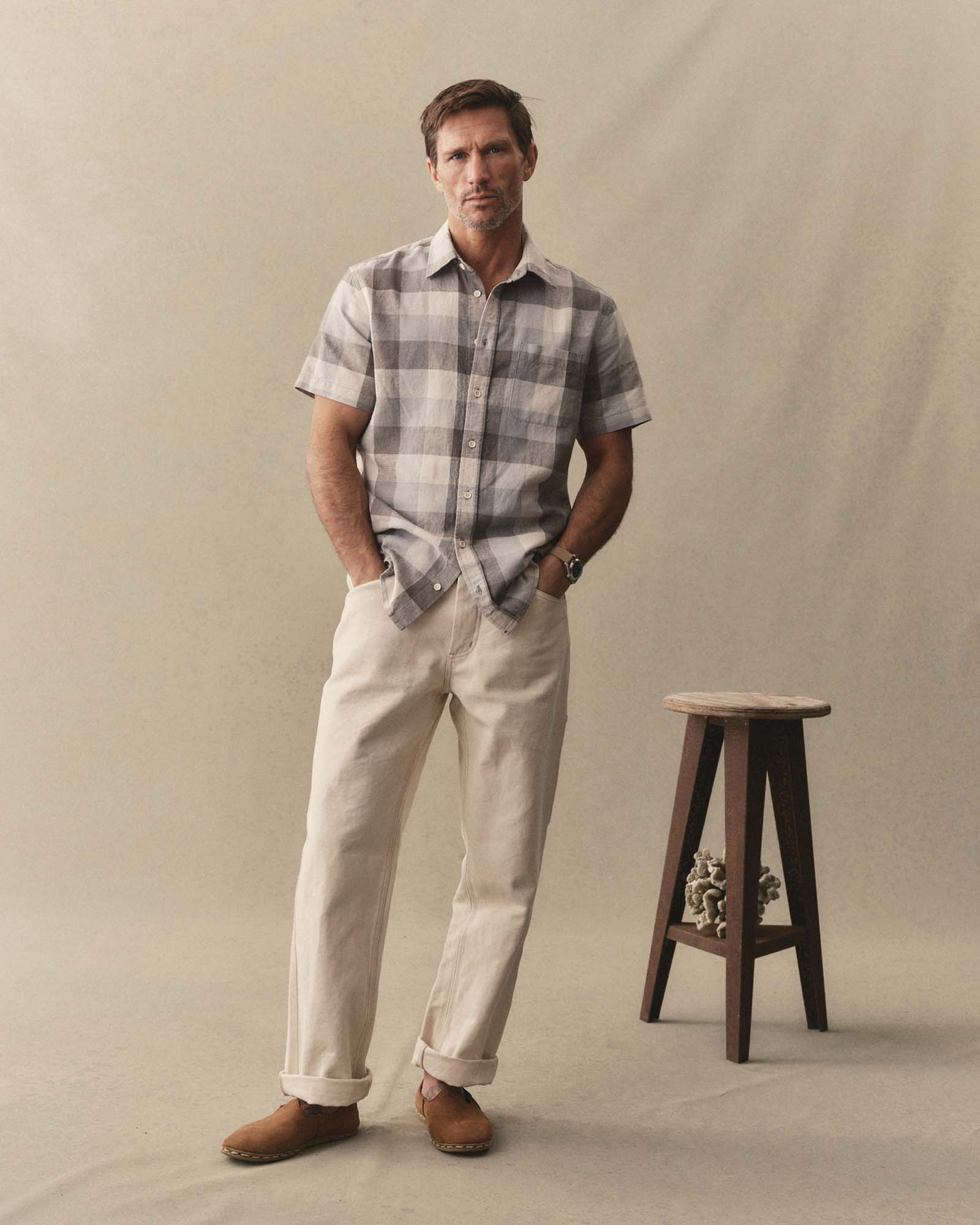 fit model posing in The Short Sleeve California in Overcast Check Hemp, Wovens by Taylor Stitch