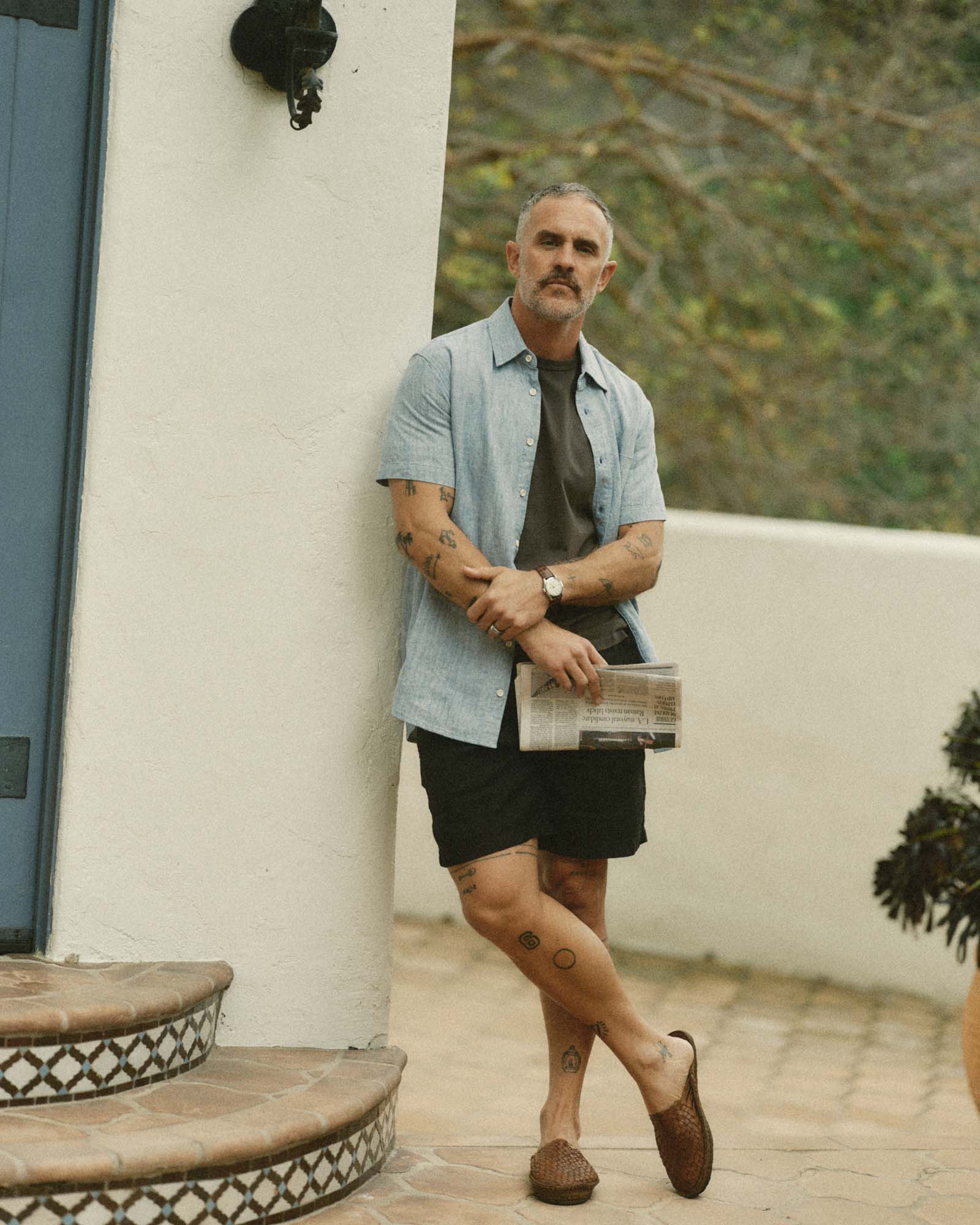 fit model posing in The Short Sleeve California in Sky Hemp, Wovens by Taylor Stitch