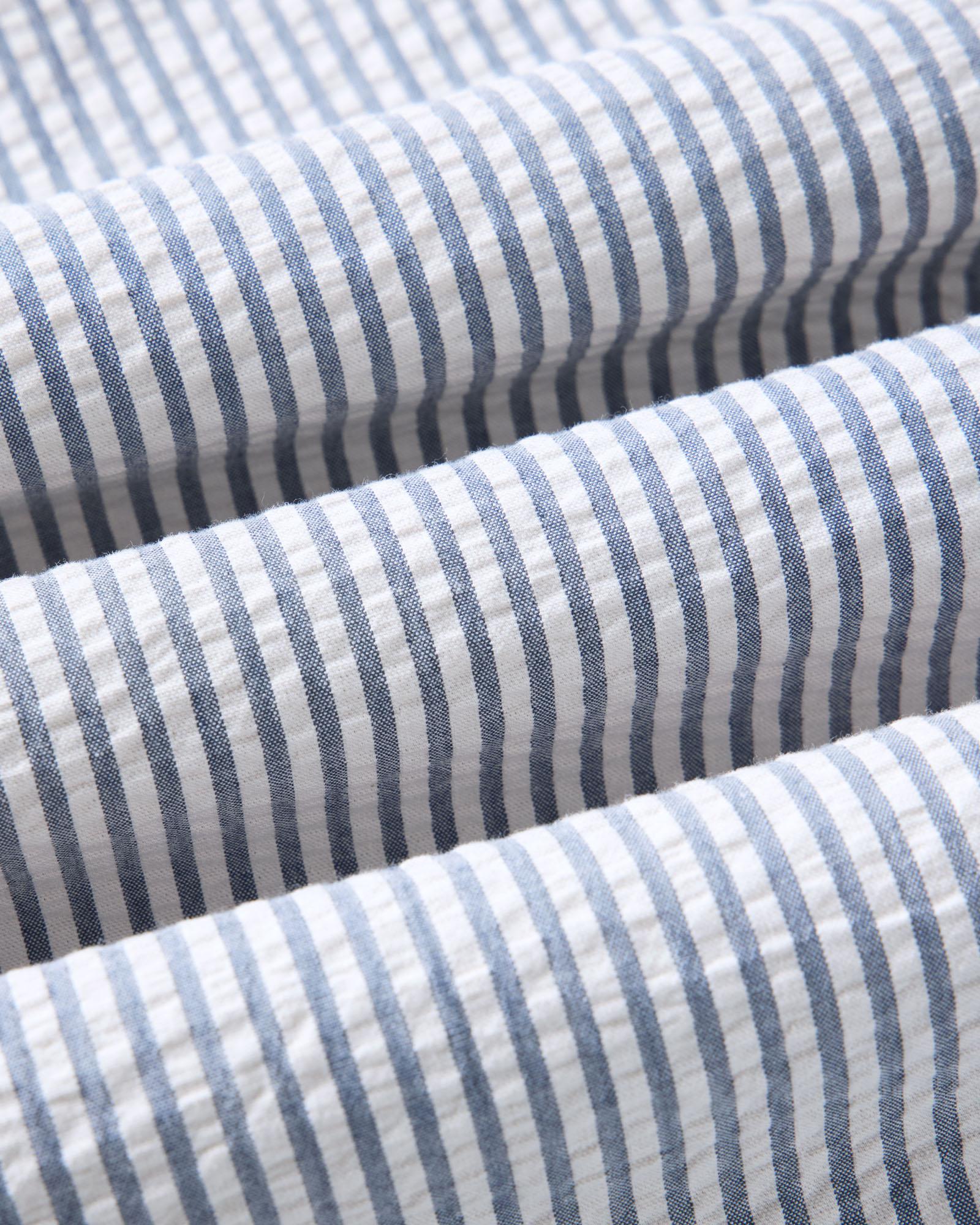 material shot of the fabric on The Short Sleeve Jack in Steel Blue Stripe Seersucker, Wovens by Taylor Stitch